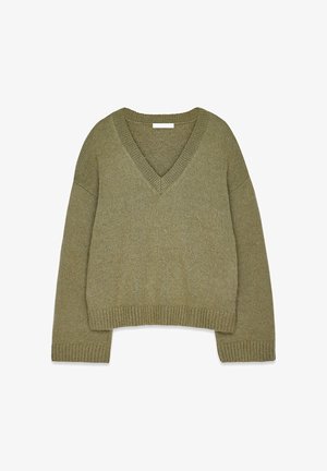 Olive green knitted sweater with a V-neck, drop shoulders, and ribbed cuffs and hem. Soft texture with a relaxed, cropped fit.