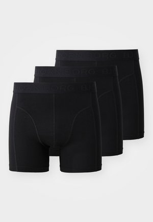 Juodos boxeriai, su nesandariu dizainu, pažymėtu logotipu ant juosmens, ir minkšta, tampri medžiaga, užtikrinančia patogumą. Iš viso trys poros.