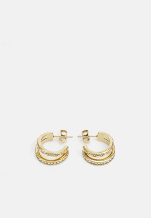 Gold-tone hoop earrings featuring three stacked designs with textured, smooth, and embellished surfaces. Includes sparkly accent detailing.