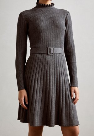 Gray ribbed knit dress with long sleeves, a ruffled high neckline, a belt with a fabric-covered buckle, and a pleated skirt.