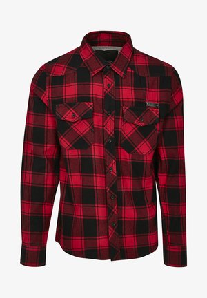 Punainen ja musta ruudullinen flanellipaita, jossa on pitkät hihat, napitus, kaksi rintataskua ja kaulus. Rakenne on teksturoitua ja siinä on ruutukuvio.