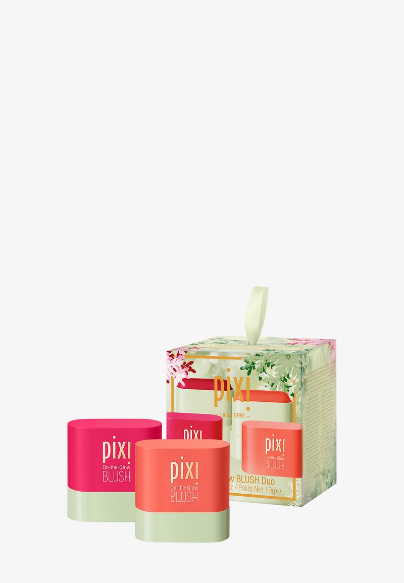 Two round blush containers in pink and coral paired with a floral-patterned green box featuring a decorative ribbon handle.