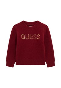 Burgundijas adīta džemperis ar garām piedurknēm un apaļu izgriezumu, ar zeltītām sekvīnu burtiem "GUESS" priekšpusē. Mīksta faktūra.