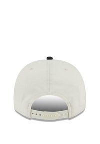 White baseball cap with a flat brim, featuring a black button on top and an adjustable plastic strap at the back. Smooth fabric texture.