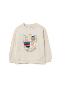 Felpa cremosa con polsini e orlo a coste, caratterizzata da una toppa ricamata a forma di scudo con le lettere "K," "S," e un design di un orsetto.