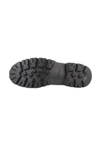 Semelle extérieure en caoutchouc noir avec des crampons profonds pour une bonne adhérence. Présente des motifs en relief et un logo. Profil plat adapté à une utilisation en extérieur.