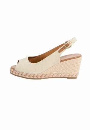 Beeži kangast kiilkontsaga sandaal avatud varbaosaga, põimitud jutikontsa ja reguleeritava kuldse pandlaga pahkluu rihmaga.