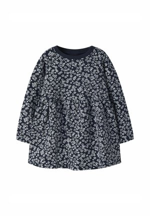 Abito blu navy con maniche lunghe, caratterizzato da un motivo floreale bianco. Design a gonna svasata, scollatura a costine e materiale in cotone.