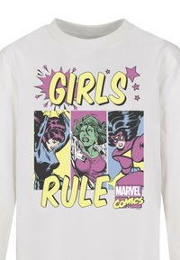 White long-sleeve shirt featuring a comic-style graphic with three female superheroes and the text "GIRLS RULE" in bold yellow letters.