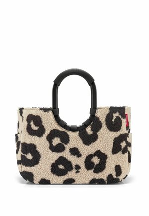 Tote bag with beige and black leopard print fleece fabric and large black oval handles with ribbed texture.