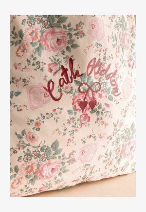 Floral fabric with pink roses and green leaves, featuring cursive red text and two hanging heart shapes in the center.