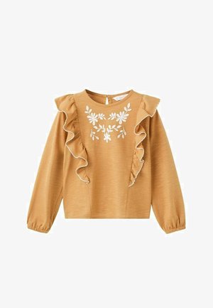 Horčicovo žltý top s dlhými balónovými rukávmi, volánovým výstrihom a bielou kvetinovou výšivkou na hrudi. Hladká textúra látky.