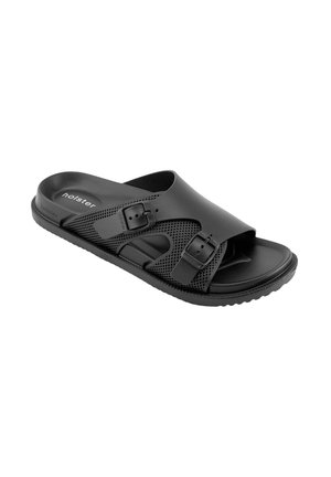 Zwarte slidesandaal met twee verstelbare gespsluitingen, een textuurrijke zool en een gevormd voetbed voor comfort.