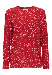 Blouse rouge à manches longues, à boutons, avec un petit motif floral blanc et un col rond.