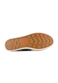 Suola di scarpa in gomma con una superficie marrone testurizzata, caratterizzata da un motivo a zigzag e bordi color crema, progettata per aderenza e durata.