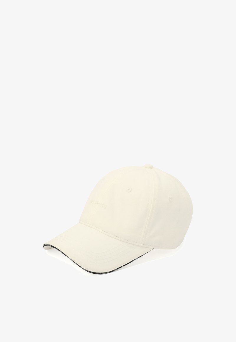 Casquette de baseball écrue avec une visière courbée et un logo texte subtil à l'avant, montrée sous un léger angle sur fond blanc.