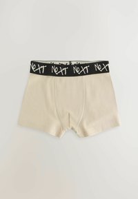 Beige Boxershorts im engen Schnitt, mit einem schwarzen Bund und weißem „NEXT“-Text. Glattes Material, übliche Nähdetails.