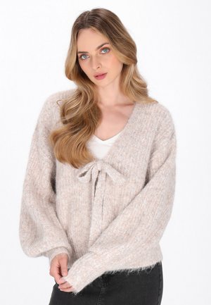 Helles beiges, gestricktes Cardigan mit V-Ausschnitt, langen Ballonärmeln und einer Bundbindung vorne. Weicher, strukturierter Stoff mit einem gemütlichen Aussehen.