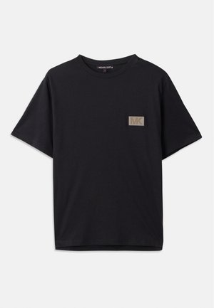 Black cotton t-shirt with short sleeves, featuring a small rectangular gold texture patch with "MK" logo on the left chest area.