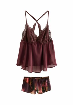 Haut de sommeil en dentelle bordeaux avec bretelles ajustables, associé à un short à motifs floraux dans des tons de couleurs similaires.