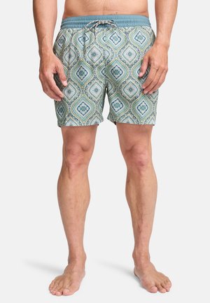 Men's swim shorts in a light blue and green geometric pattern. Features an elastic waistband with a drawstring. Soft fabric with a relaxed fit.