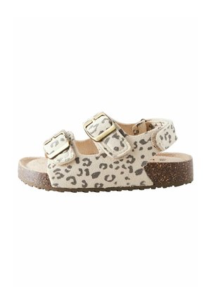 Barnesandal med åben tå med beige og sort leopardprint, to justerbare remspænder, bagrem og sål i kork-stil.