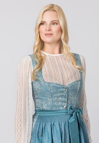 Traditionelles Dirndlkleid mit einem blauen, gemusterten Mieder, einem runden Ausschnitt, langen Spitzenärmeln und einem passenden Satinband.