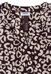 Chemise en lin à imprimé léopard marron et beige avec col en V boutonné et étiquette de la marque "CECIL" au col.