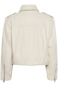 Light beige cropped leather jacket with a high collar, shoulder epaulettes, and side zippers, featuring a smooth texture and tailored fit.
