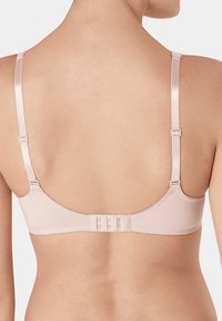 Reggiseno rosa chiaro con spalline in satin regolabili, texture liscia e chiusura a gancio sul retro. Design semplice senza motivi visibili.