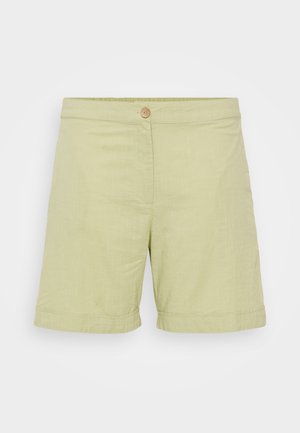 Gai zaļi linu šorti ar pogu aizdari, gludu tekstūru, sarullētajiem malām un vienkāršu, taisnu siluetu.