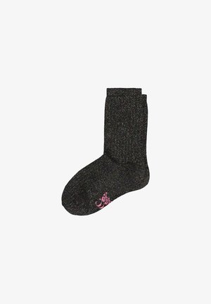 Un único calcetín negro brillante con puño acanalado y pequeño diseño decorativo rosa cerca de los dedos sobre fondo blanco.