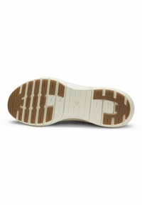 Σόλα παπουτσιού με υφασμένο λευκό καουτσούκ, με καφέ μοτίβο πέλματος για κράτημα. Σημαδεμένη με κυκλικό σύμβολο στο κέντρο.