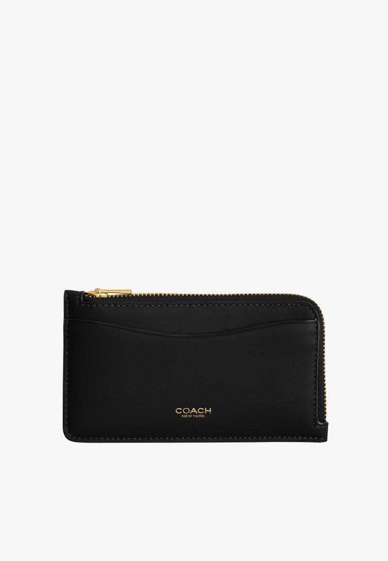Portacarte Coach in pelle nera con cerniera dorata e logo, con una fessura frontale per carte e design compatto e sottile.