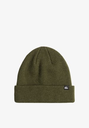 Green knitted beanie hat with a folded cuff and textured fabric. Features a small black logo tag on the side.