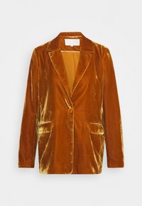 Blazer en velours dans une teinte orange-brun chaude. Il présente un col cranté, une fermeture à un bouton et deux poches avant. Texture lisse.