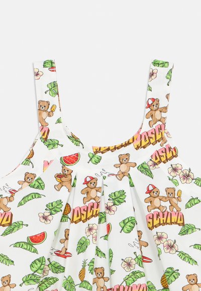 Λευκό αμάνικο ύφασμα με παιχνιδιάρικα αρκουδάκια, πράσινα τροπικά φύλλα, λουλούδια, ανανάδες, φέτες καρπουζιού και πολύχρωμο μοτίβο με το κείμενο "MOSCHINO".