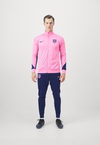 Nike Performance ATLETICO MADRID NIKE DF STRIKE TRACKSUIT THIRD - Equipación de clubes - pink glow/blue void