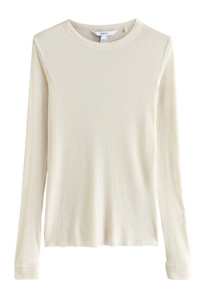 Kremo spalvos, ilgomis rankovėmis, dygsniuotas megztinis su apvalia iškirpte ir aptriu siluetu.