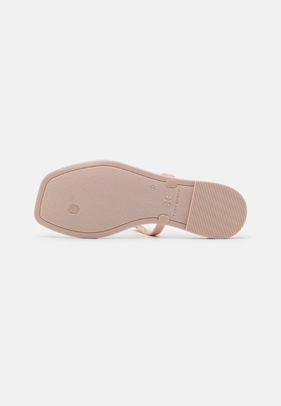 Light pink sandal sole with a smooth finish, featuring a rectangular shape and a textured bottom for grip. Brand logo embossed.