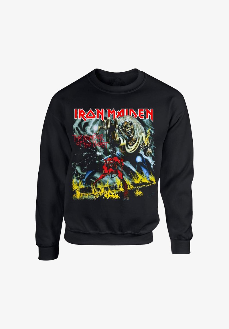 Mustapaita, jossa on värikäs graafinen kuva demonista ja luurangosta. Tekstissä lukee "Iron Maiden" ja "The Number of the Beast."