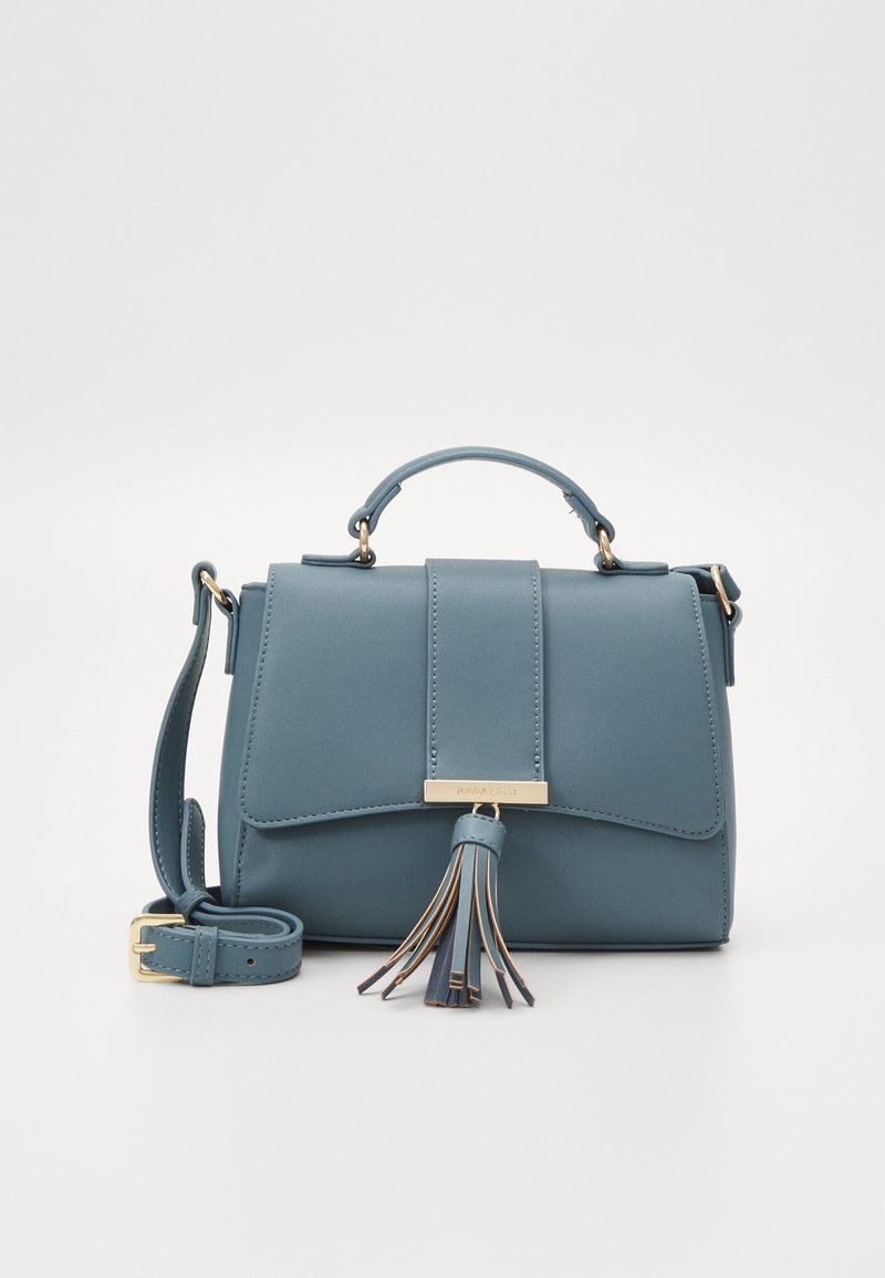 Blue leather handbag with top handle, detachable shoulder strap, gold hardware, and front tassel detail. Rectangular shape with flap closure.