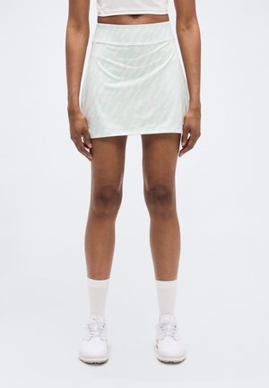 Hvid mininederdel med et diskret mintgrønt abstrakt mønster, glat tekstur, høj talje og en figursyet pasform.