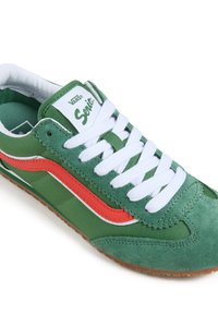 Green suede and textile sneaker with white laces and an orange side stripe. Features padded collar and classic Vans logo on tongue.