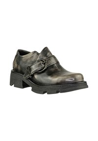 Scarpa nera di pelle con finitura lucida, caratterizzata da una larga cinghia e una fibbia rotonda, suola in gomma robusta e tacco leggermente sollevato.