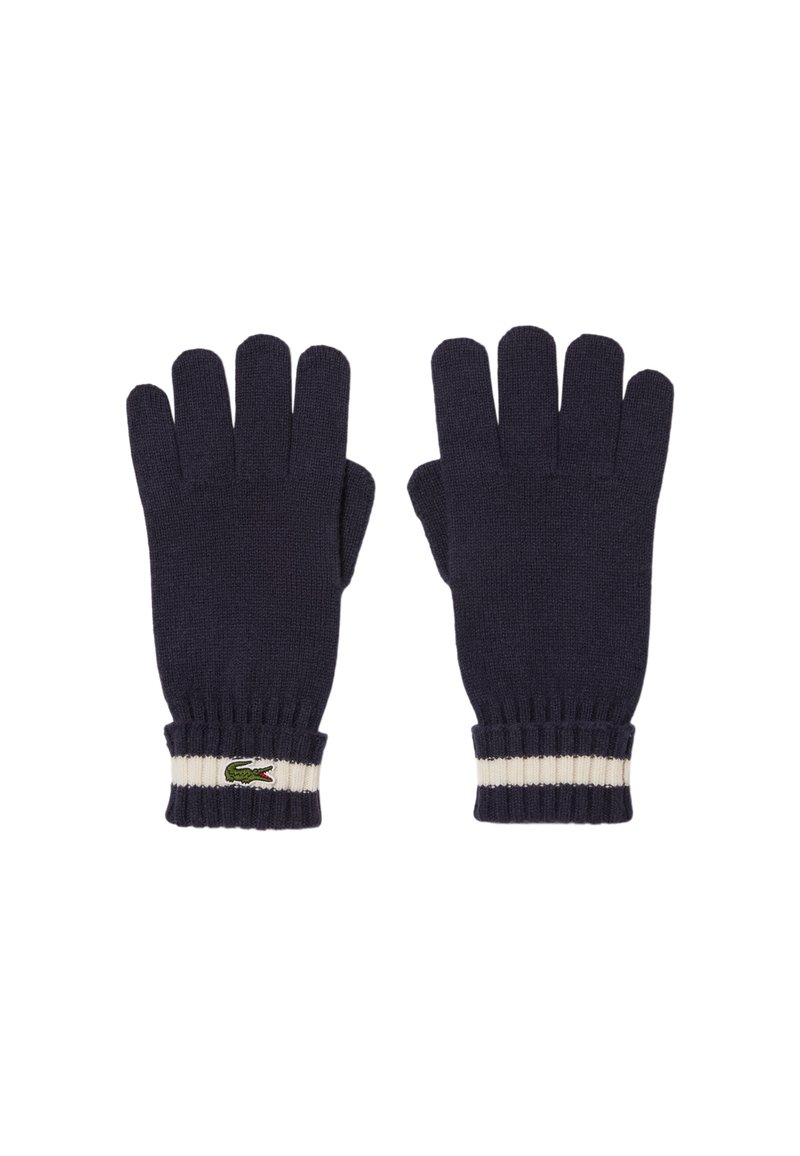 Guantes de punto color navy con cinco aberturas para los dedos, puños acanalados con una franja blanca y un pequeño logo de cocodrilo verde en la muñeca.