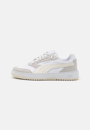 White and light gray Puma sneaker with suede details, lace-up closure, and textured sole, shown from the outer side on a white background.