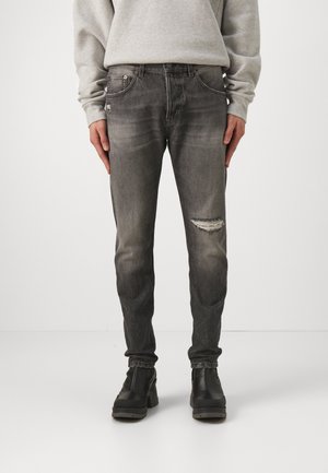 Vervaagde zwarte denim jeans met een slim fit, voorzien van een versleten knie, traditionele vijf-pocket ontwerp en een knoopsluiting.