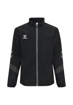 Black full-zip sports jacket with white zipper, gray chevron stripes on sleeves, and white hummel logo on the chest.