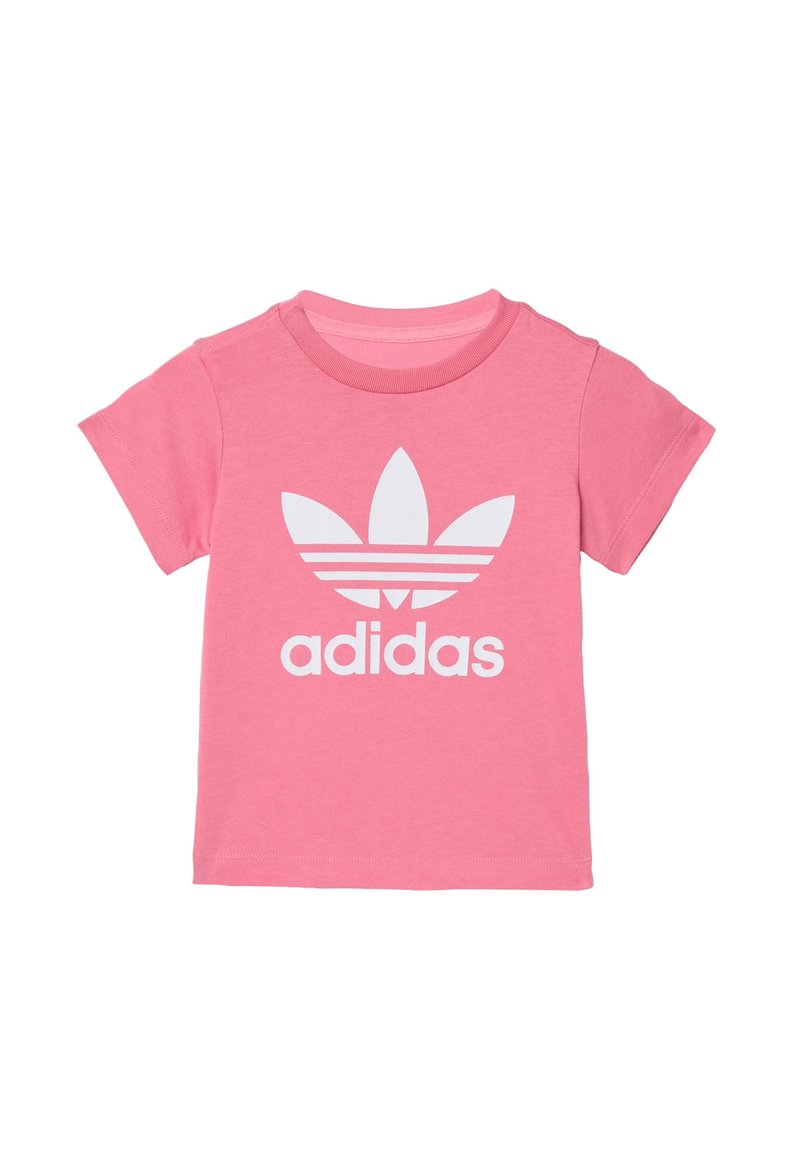 Pink cotton t-shirt with short sleeves, featuring a large white Adidas logo and three white stripes above. Classic round neckline.